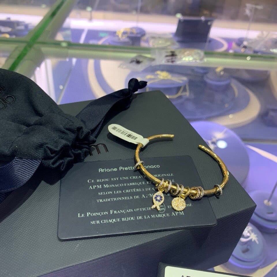 APM Monaco Gold Tone Bracelet with Fish and Star Charms